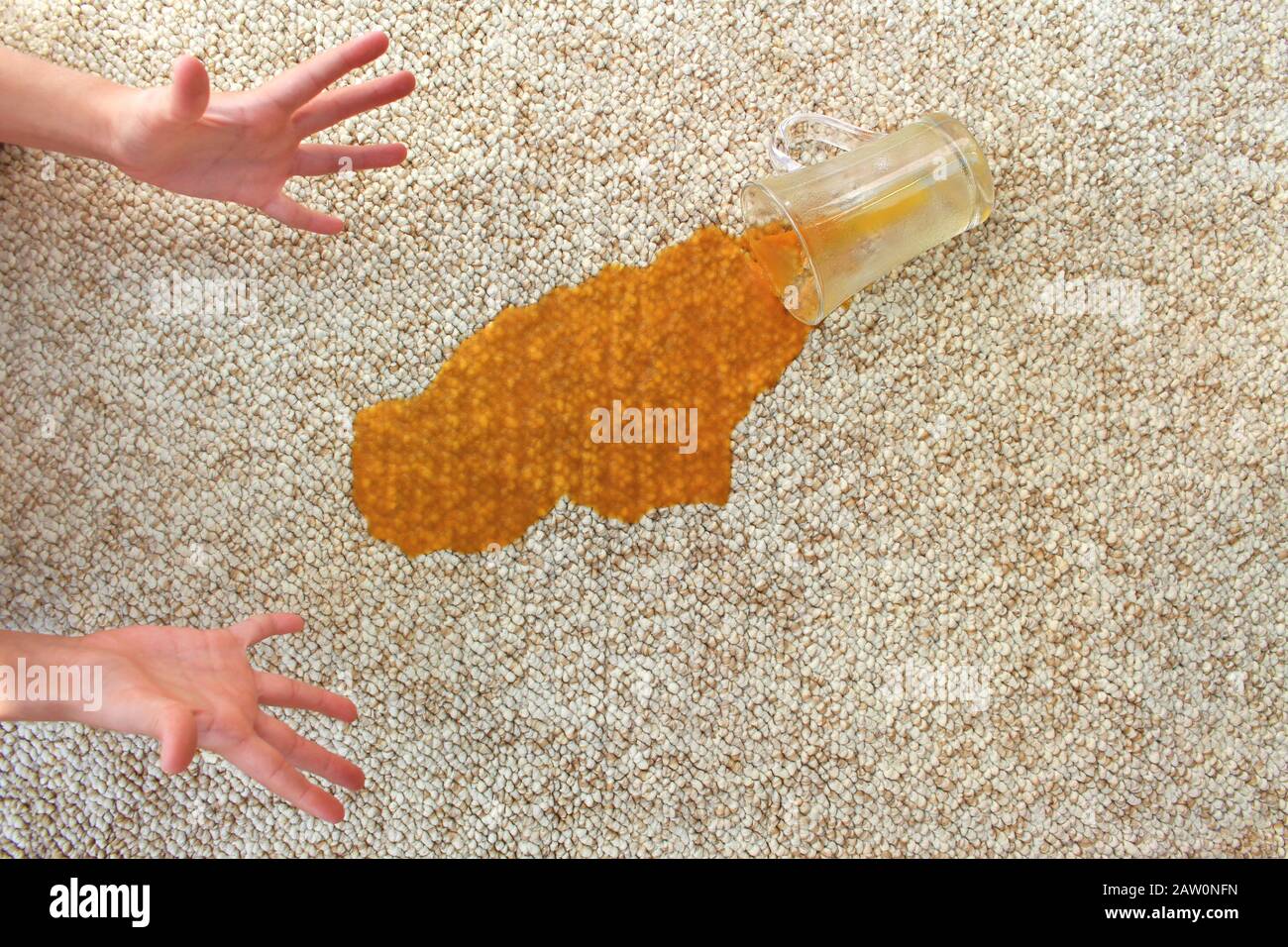 Glass of juice fell on carpet. Drink spilled on floor Stock Photo Alamy