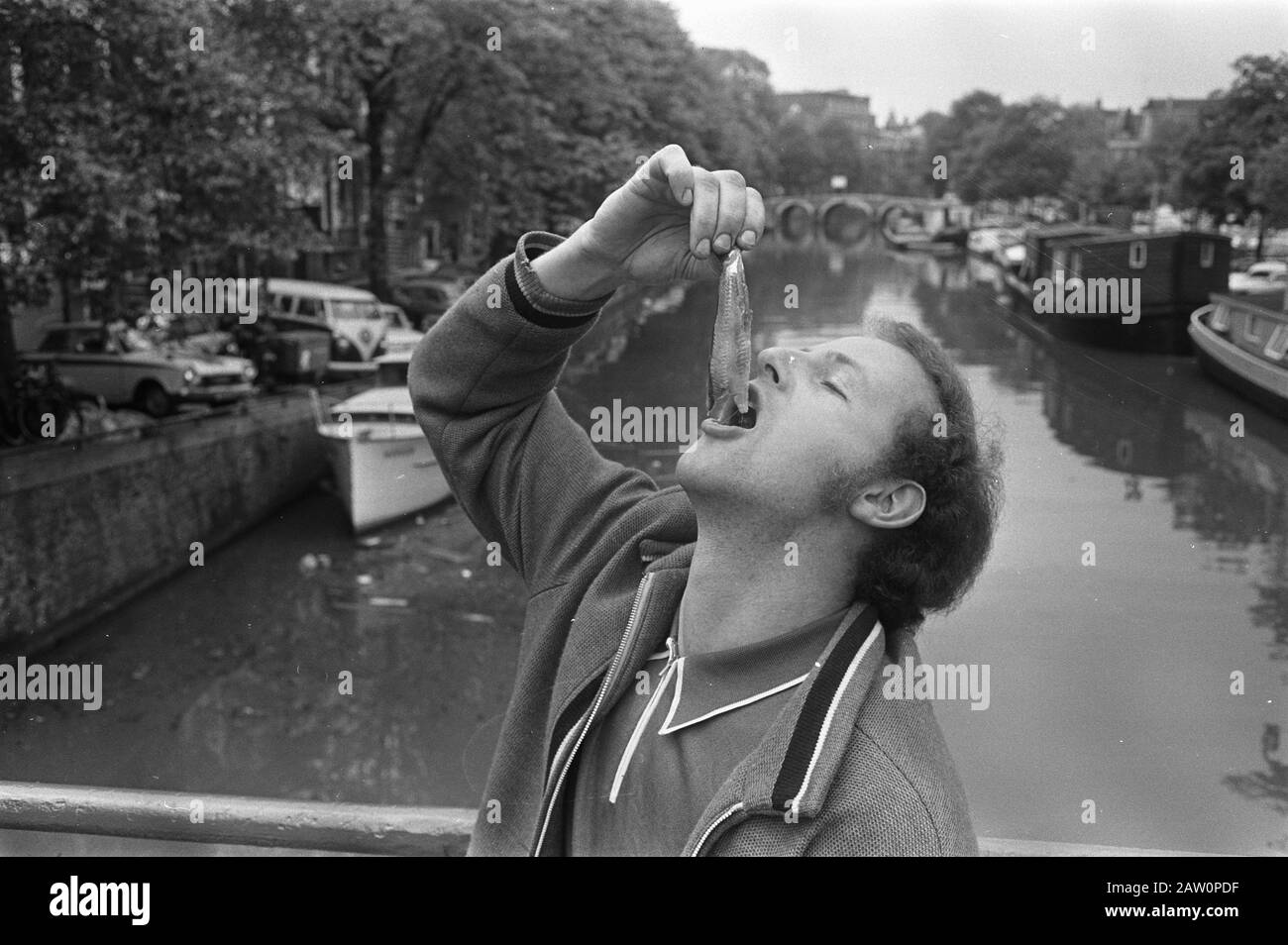 New herring; Man eating herring, Amsterdam Date May 28, 1970 Location