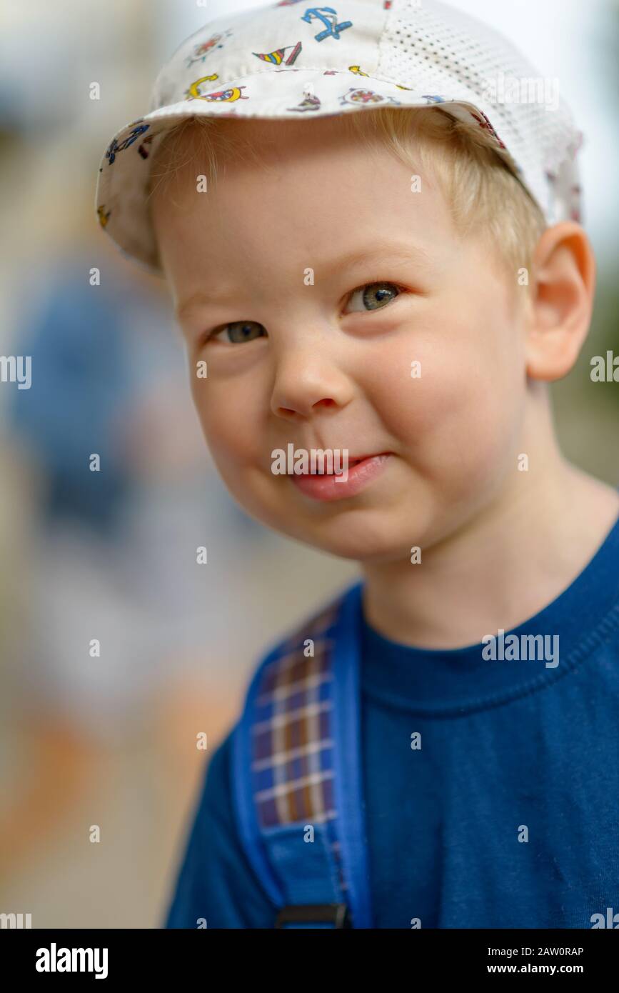 Portrait of a smiling boy in a T-shirt and cap. Stock Photo