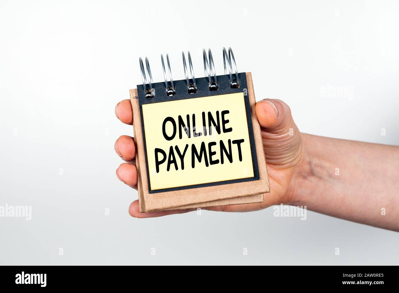 Online Payment. Purchase, Sale, Transfers and Financial Transactions Concept. Note book in hand on white background Stock Photo