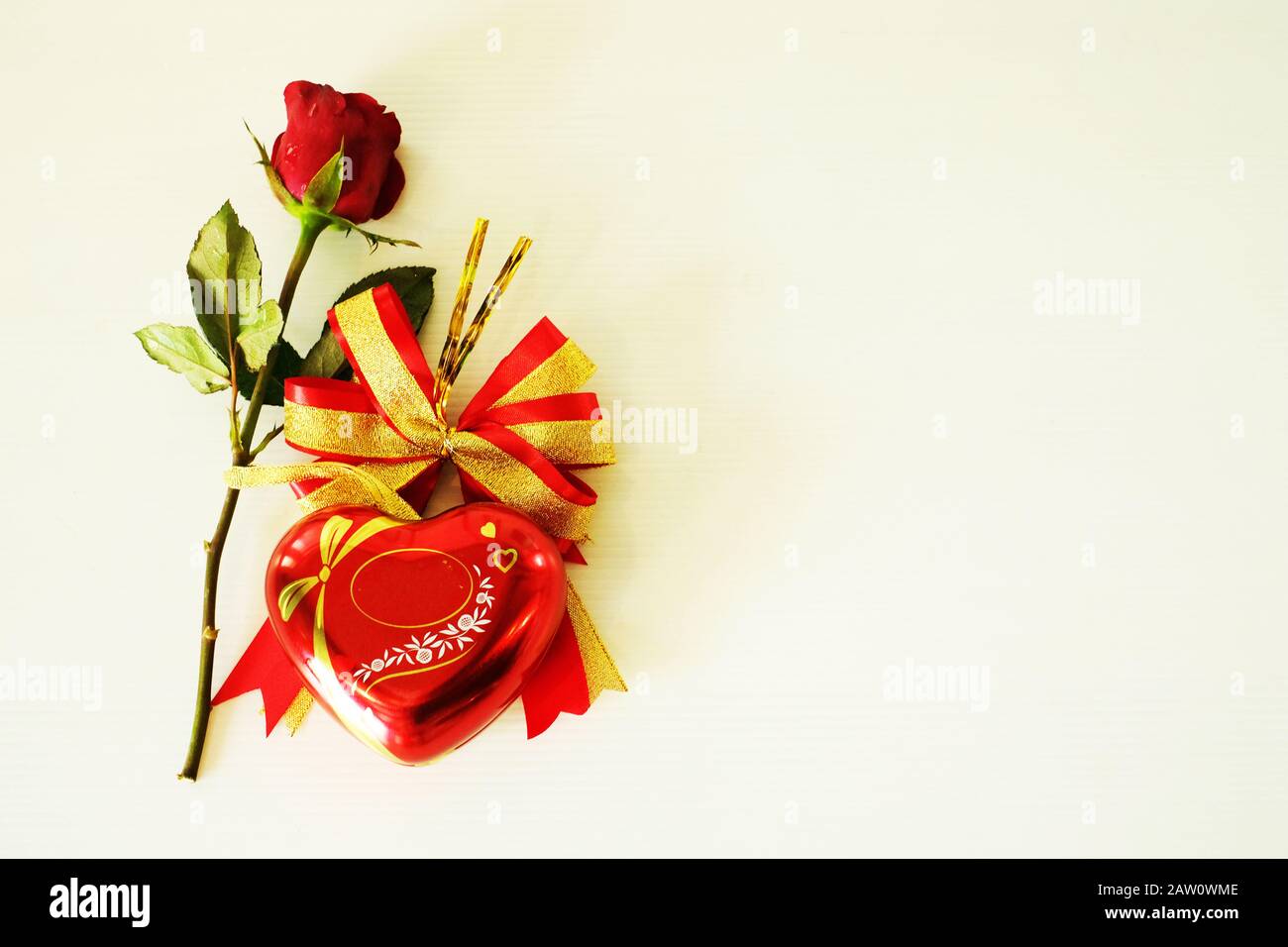 Red rose with heart on white background Stock Photo - Alamy