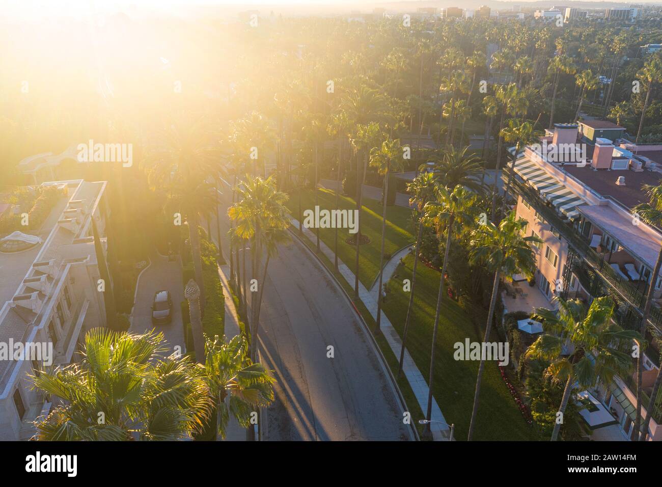 Stunning aerial view of Beverly Hills neighborhood, Beverly Hills Hotel, and Sunset Boulevard surrounded with palm trees in Los Angeles, California. Stock Photo