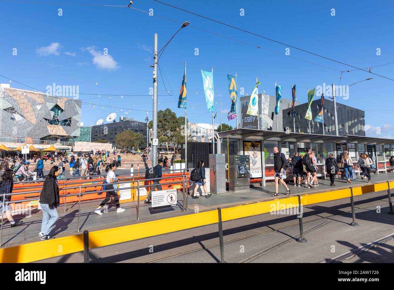 Melbourne tram stop near federation square with commuters waiting for a tram,Melbourne,Australia Stock Photo
