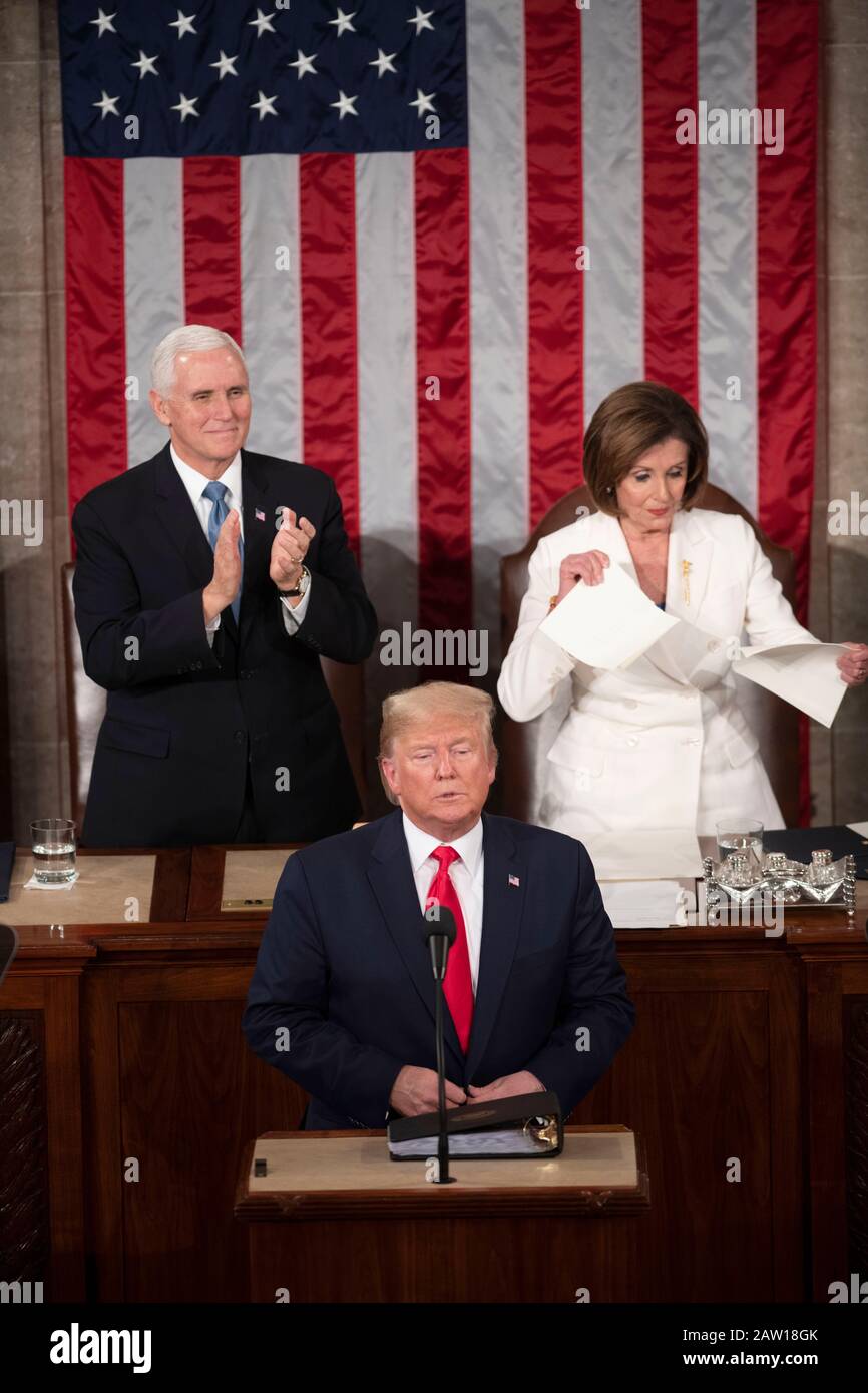 Beijing, USA. 4th Feb, 2020. House Speaker Nancy Pelosi (R, back) tears up what appeared to be a copy of the president's speech during U.S. President Donald Trump's (front) State of the Union address to a joint session of Congress on Capitol Hill in Washington, DC, the United States, Feb. 4, 2020. Credit: Liu Jie/Xinhua/Alamy Live News Stock Photo