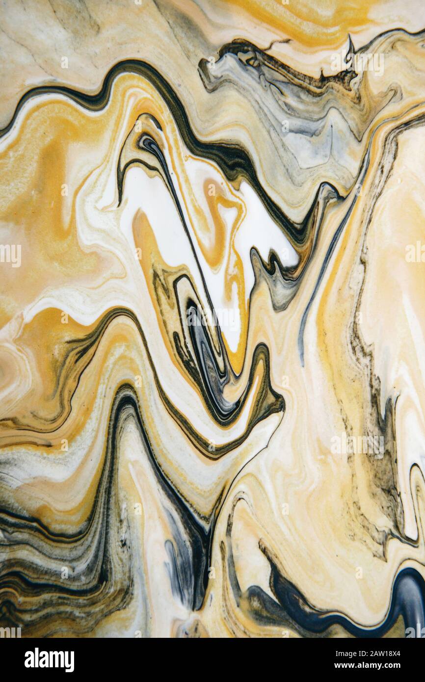 marble texture formed by mixing the black and white acrylic paint, abstract  background Stock Photo