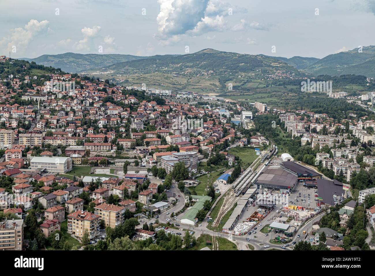 Bird's eye view of Sarajevo railway station, and the nova Sarajevo buildings, surrounded by the  mountains.Urban view. Stock Photo