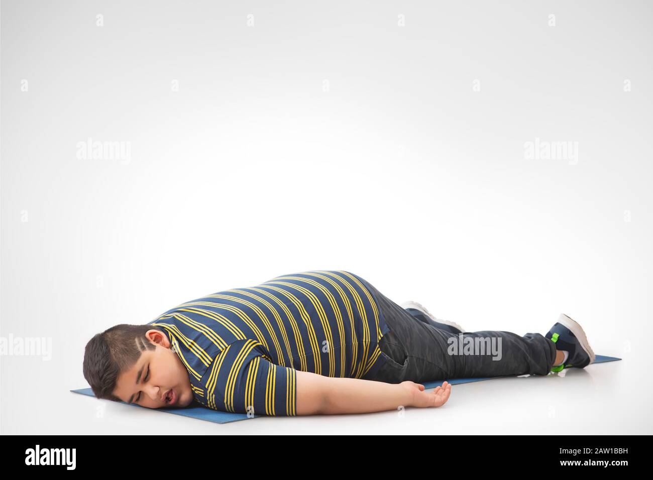 Small Boy On Yoga Mat Home Stock Photo 1703802922