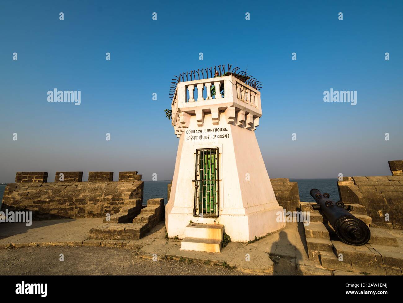 Diu, India - December 2018: The old whitewashed Couraca lighthouse inside the ancient, Portuguese built fort in the island of Diu. Stock Photo