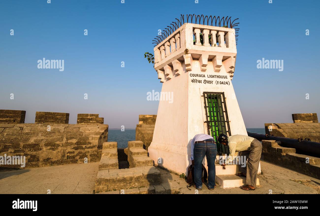 Diu, India - December 2018: The old whitewashed Couraca lighthouse inside the ancient, Portuguese built Diu Fort. Stock Photo