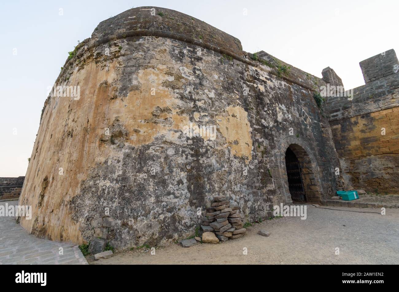 The exterior facade of a fortification inside the ancient Portuguese built fort in the island of Diu in India. Stock Photo