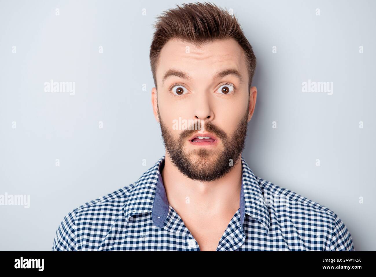 Portrait of shocked young bearded guy with open mouth Stock Photo - Alamy