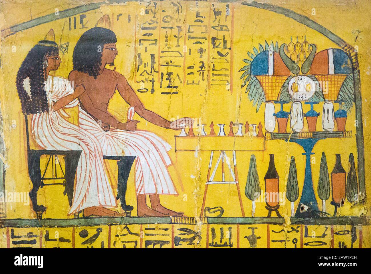 Cairo, Egyptian Museum, from the tomb of Sennedjem, Deir el Medina : Door panel (recto), Sennedjem following by his wife is playing the Senet game. Stock Photo