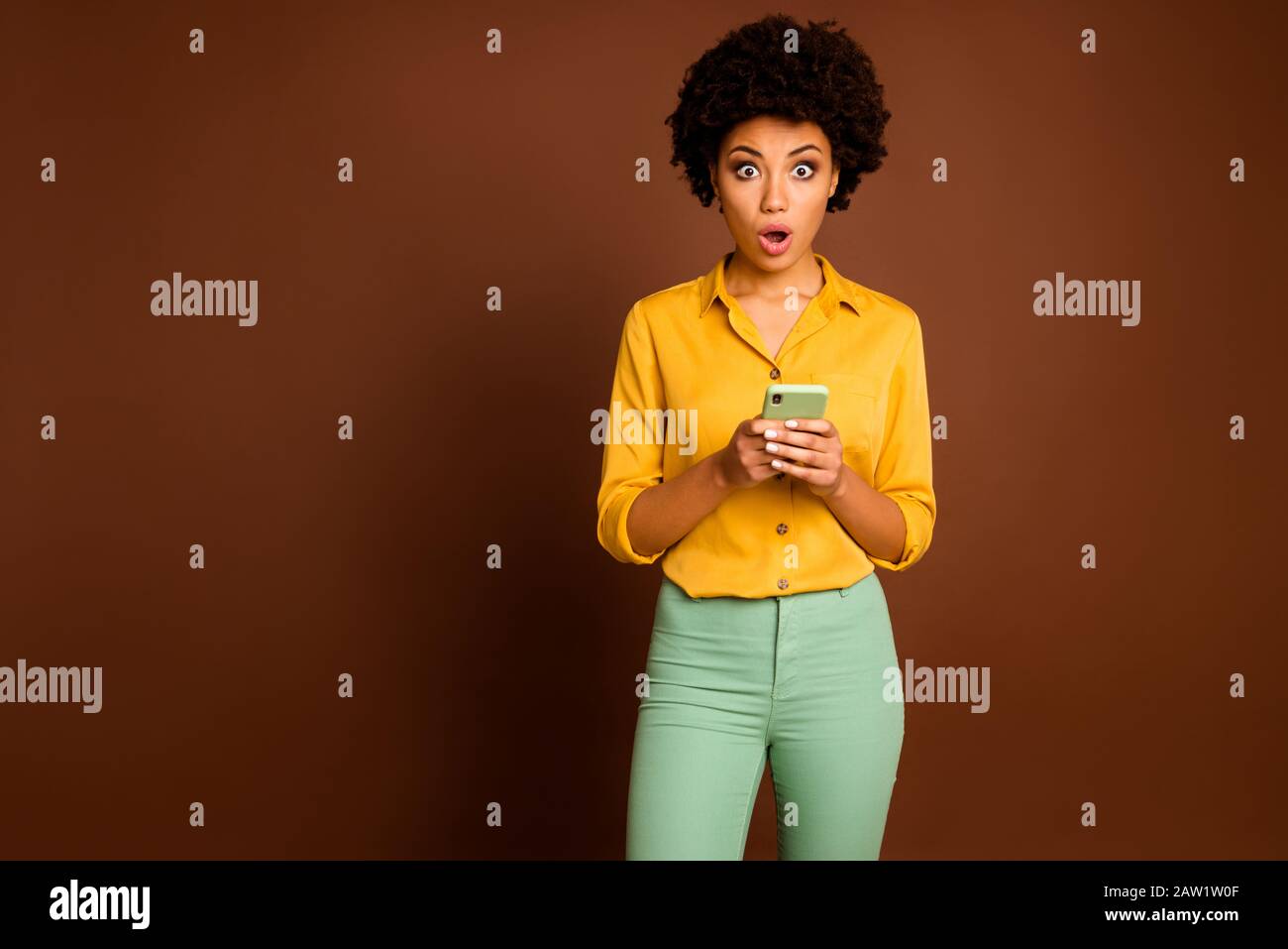 yellow shirt and green pants