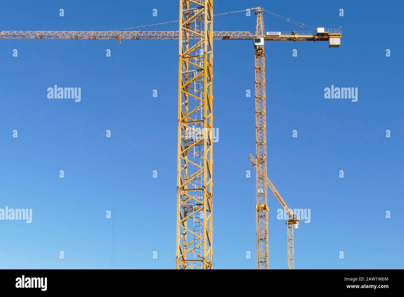 Yellow Construction cranes in Bremen's Überseestadt, Bremen, Germany, Europe Stock Photo