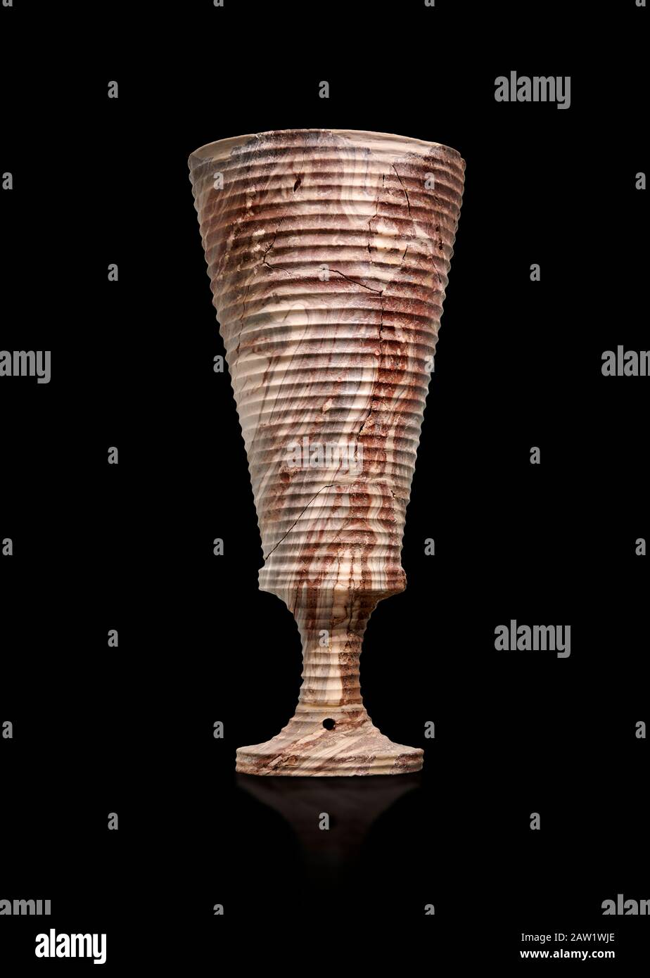 Minoan stone chalice made of spotted Nisyros Obsidian, Zakros central sanctuary complex 1500-1400 BC; Heraklion Archaeological  Museum, black backgrou Stock Photo