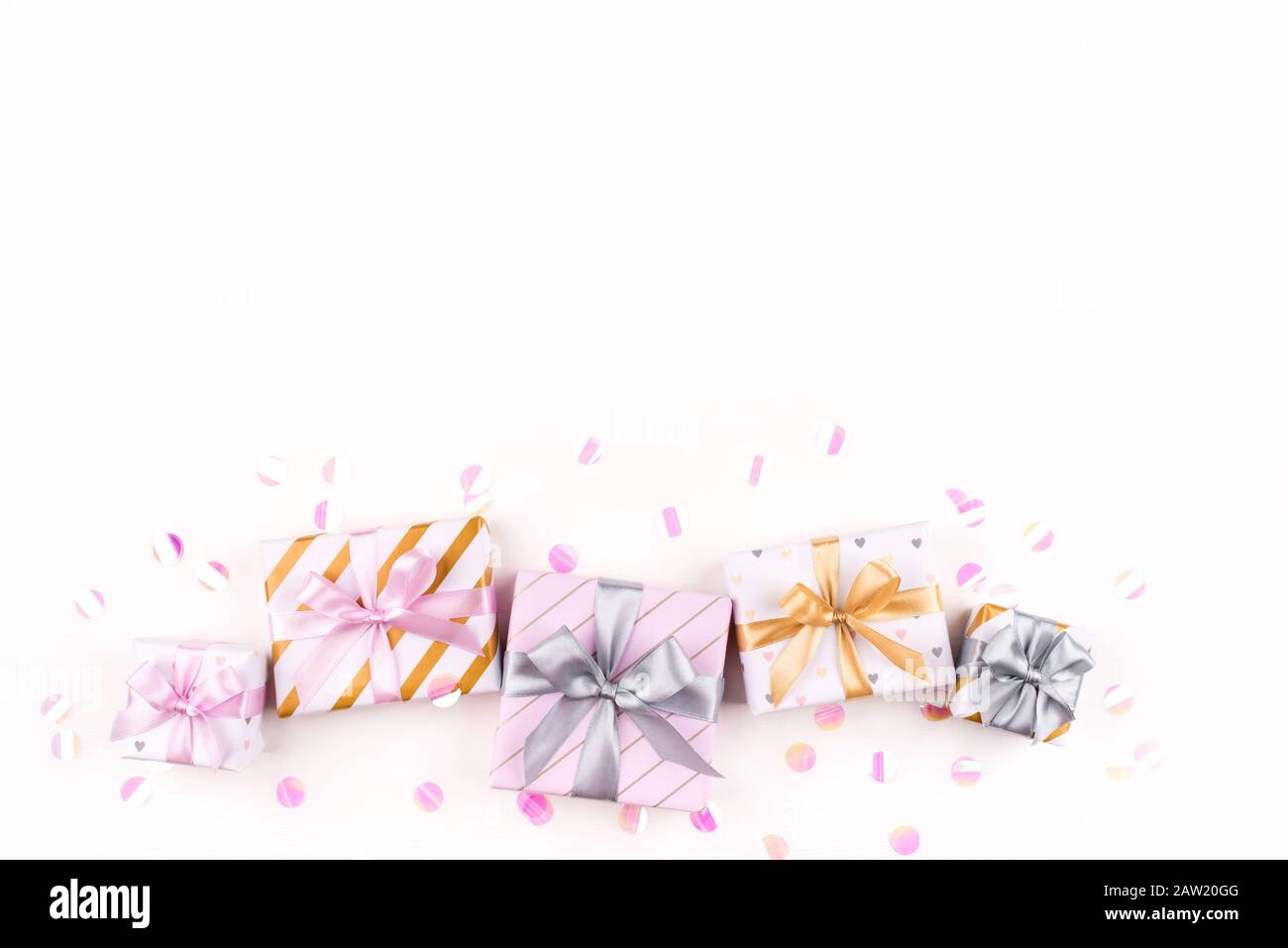 Set of gift boxes with bows and confetti on a white background Stock ...
