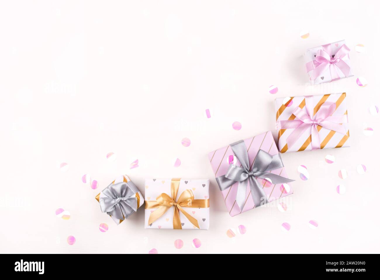 Several gift boxes with bows and confetti on a white background Stock ...