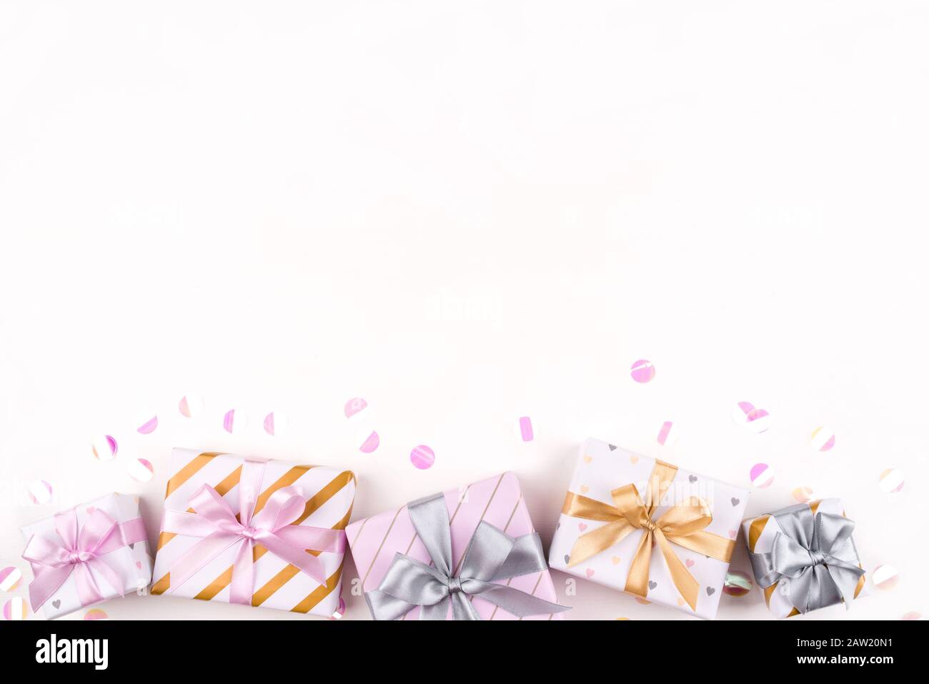 Set of gift boxes with bows and confetti on a white background Stock ...