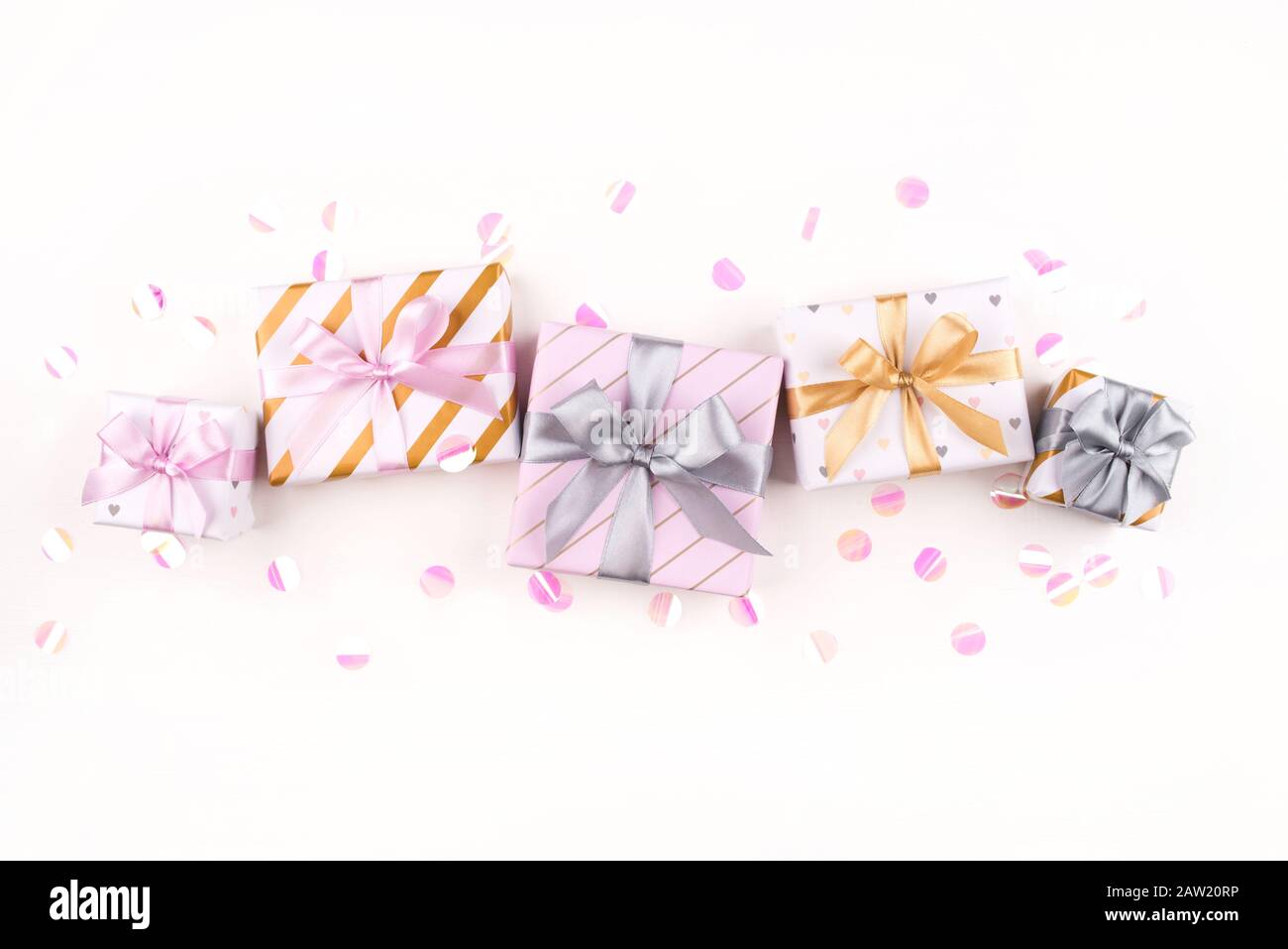 Set of gift boxes with bows and confetti on a white background Stock ...