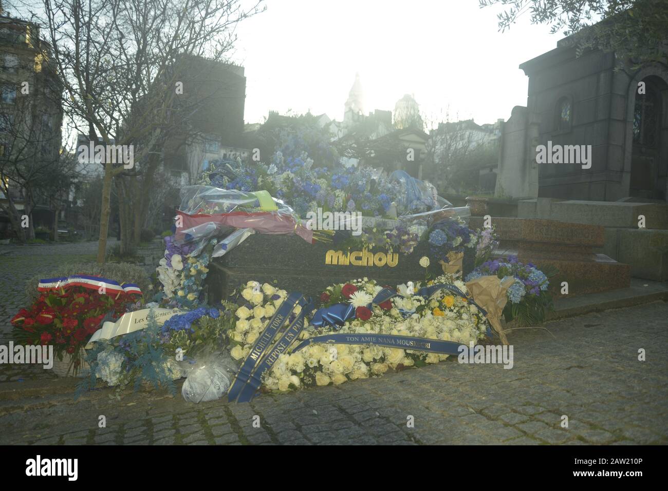 Wreaths and flowers at the resting place of entertainer and drag artist Michou in Montmartre, Paris, pasakdek Stock Photo