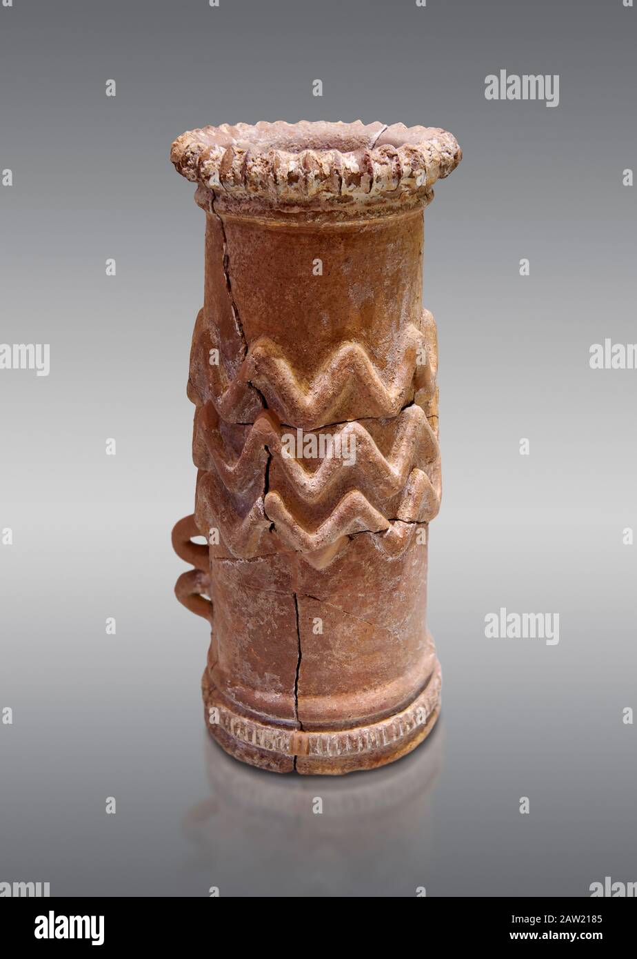 Minoan cylindrical cult vessel base used to support vessels full of offerings ,  1300-1100 BC,  Heraklion Archaeological  Museum, grey background .  T Stock Photo