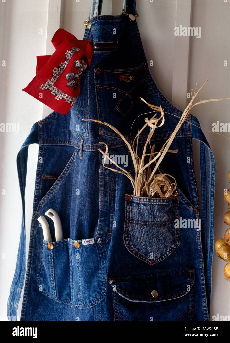 Close-up of a gardener's apron made from an old pair of denim jeans with  pockets for raffia and secateurs Stock Photo - Alamy