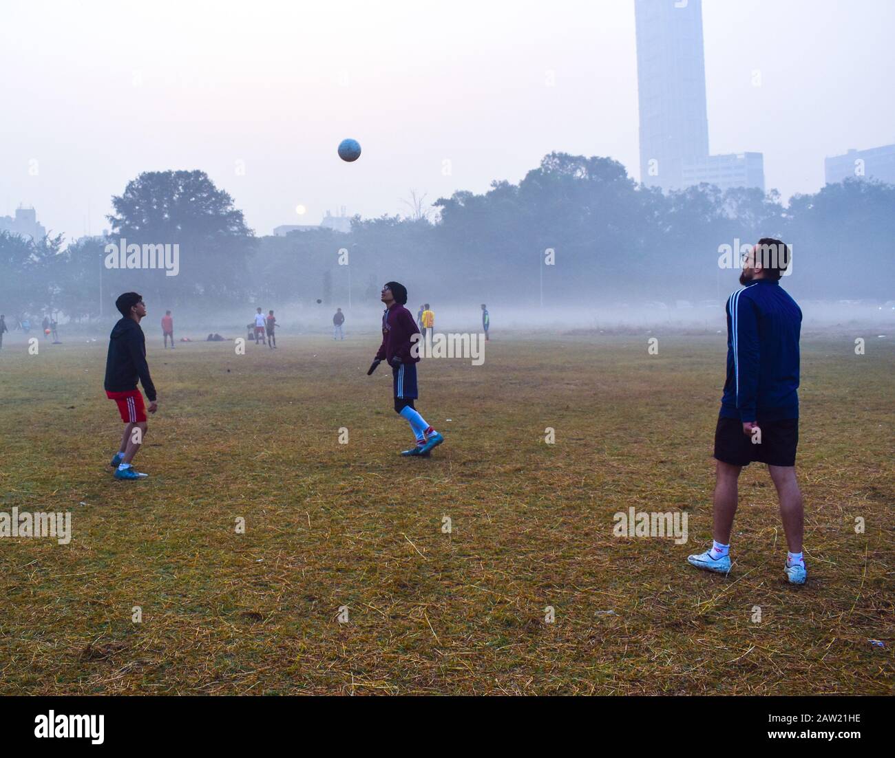 Peoples are playing football and doing exercises on a morning in Kolkata, India. Stock Photo