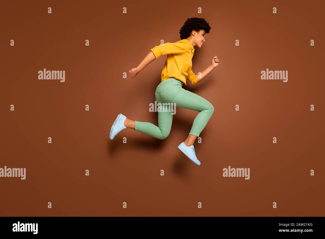 Full length photo of funny dark skin lady jumping up high rushing ...