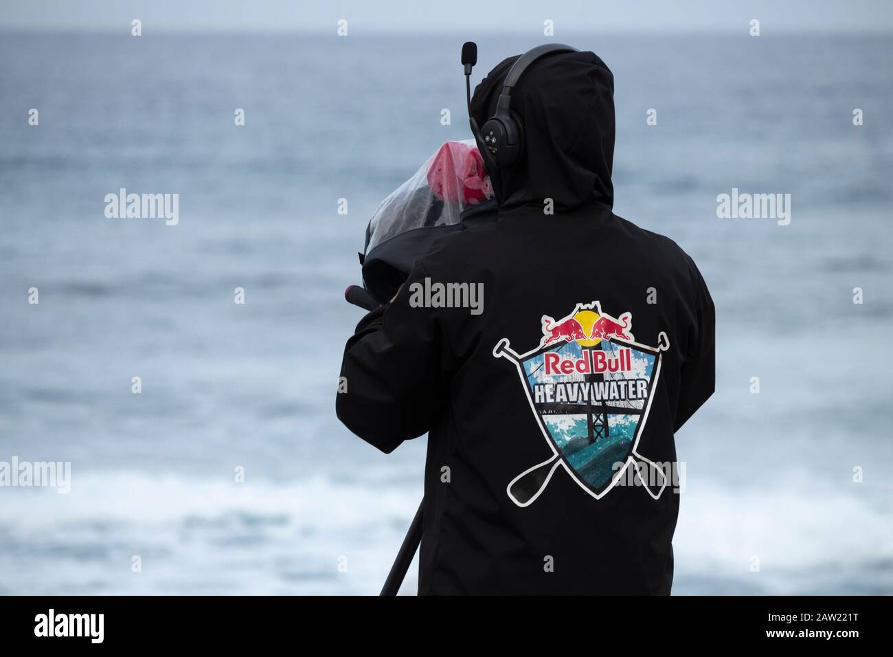 Cameraman live streaming Red Bull sponsered surfing competition Stock Photo