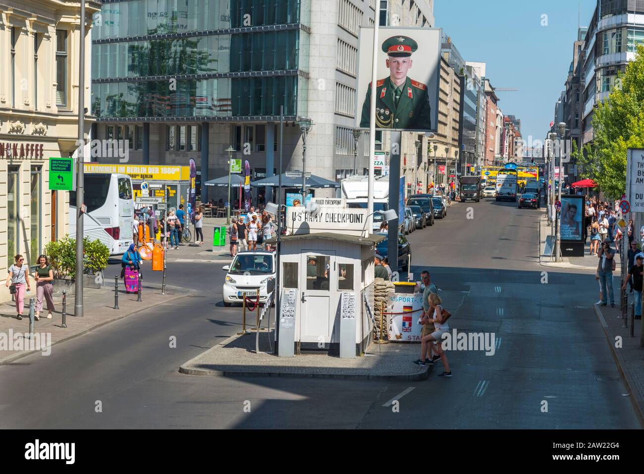 BERLIN, GERMANY - MAY 25, 2018: Tourists at the popular Checkpoint Charlie in Berlin, a reproduction of the historic crossing point between East Berli Stock Photo