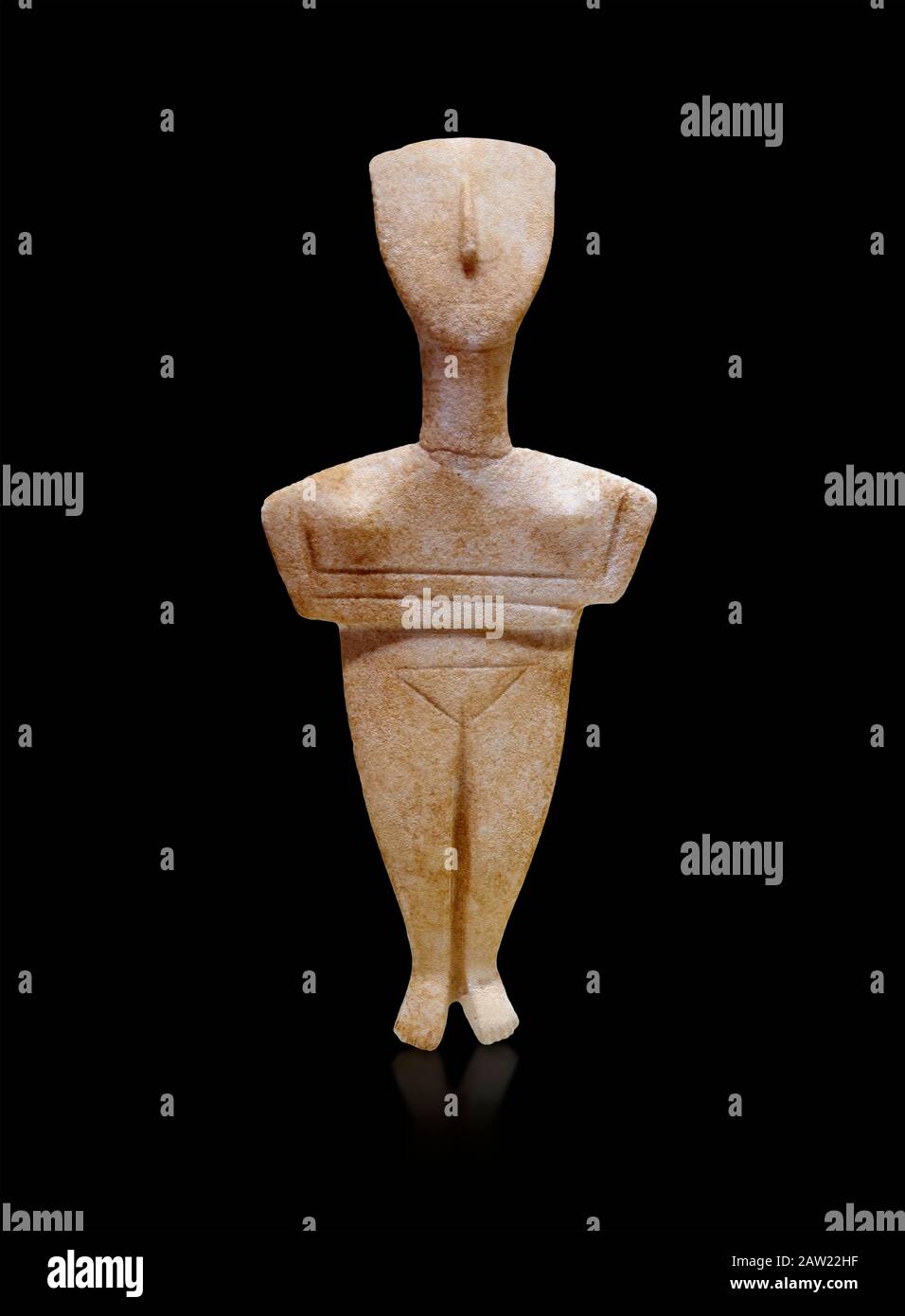 Cyclades spedos type stone statue figurine with folded arms, Archanes Phourni, 2300-1700 BC. Heraklion Archaeological Museum, black background.  These Stock Photo