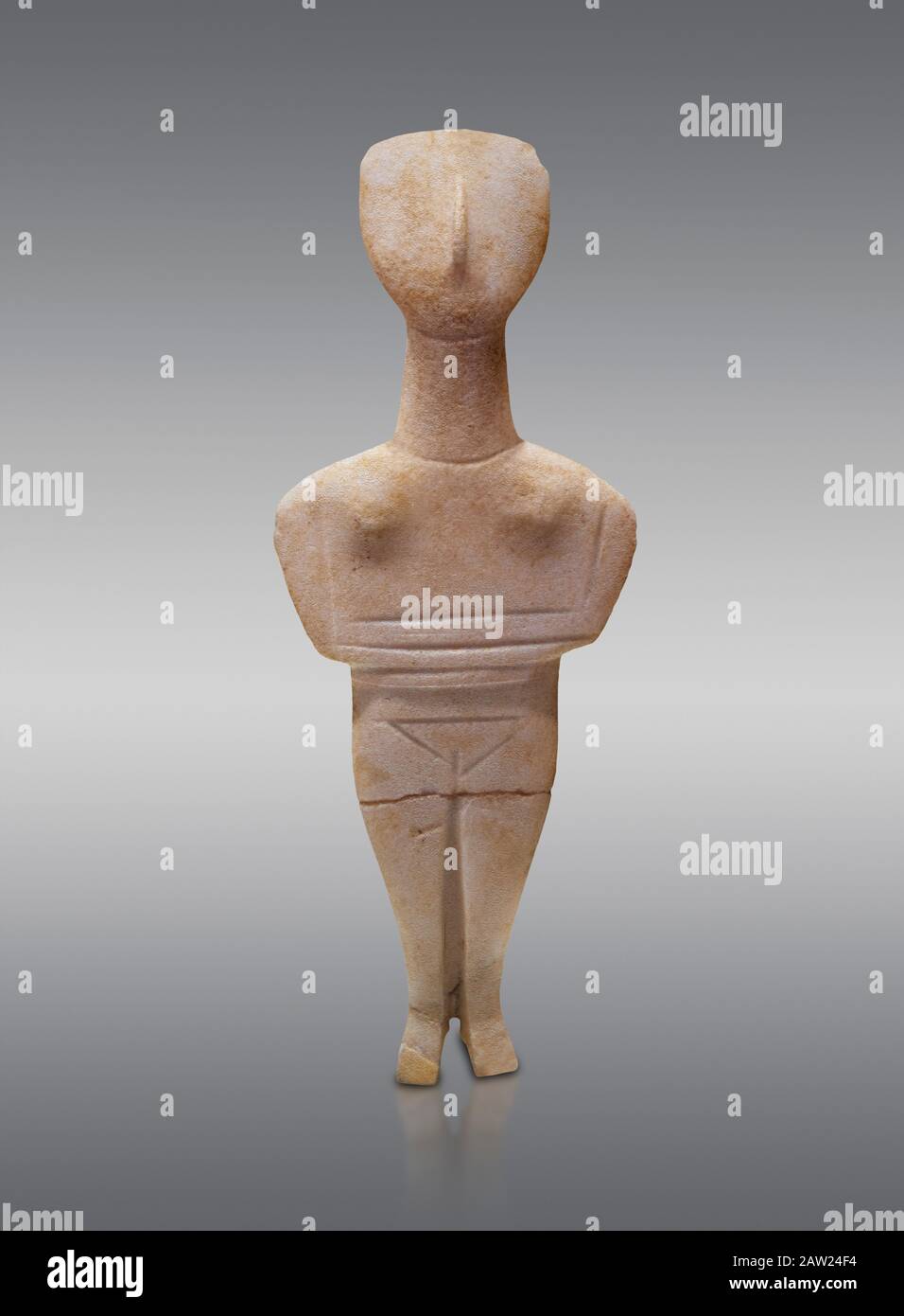 Cyclades spedos type stone statue figurine with folded arms, Archanes Phourni, 2300-1700 BC. Heraklion Archaeological Museum, grey background.  These Stock Photo