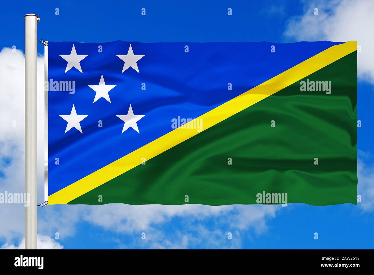 flag of Salomon Islands in front of blue cloudy sky, Salomon Islands Stock Photo