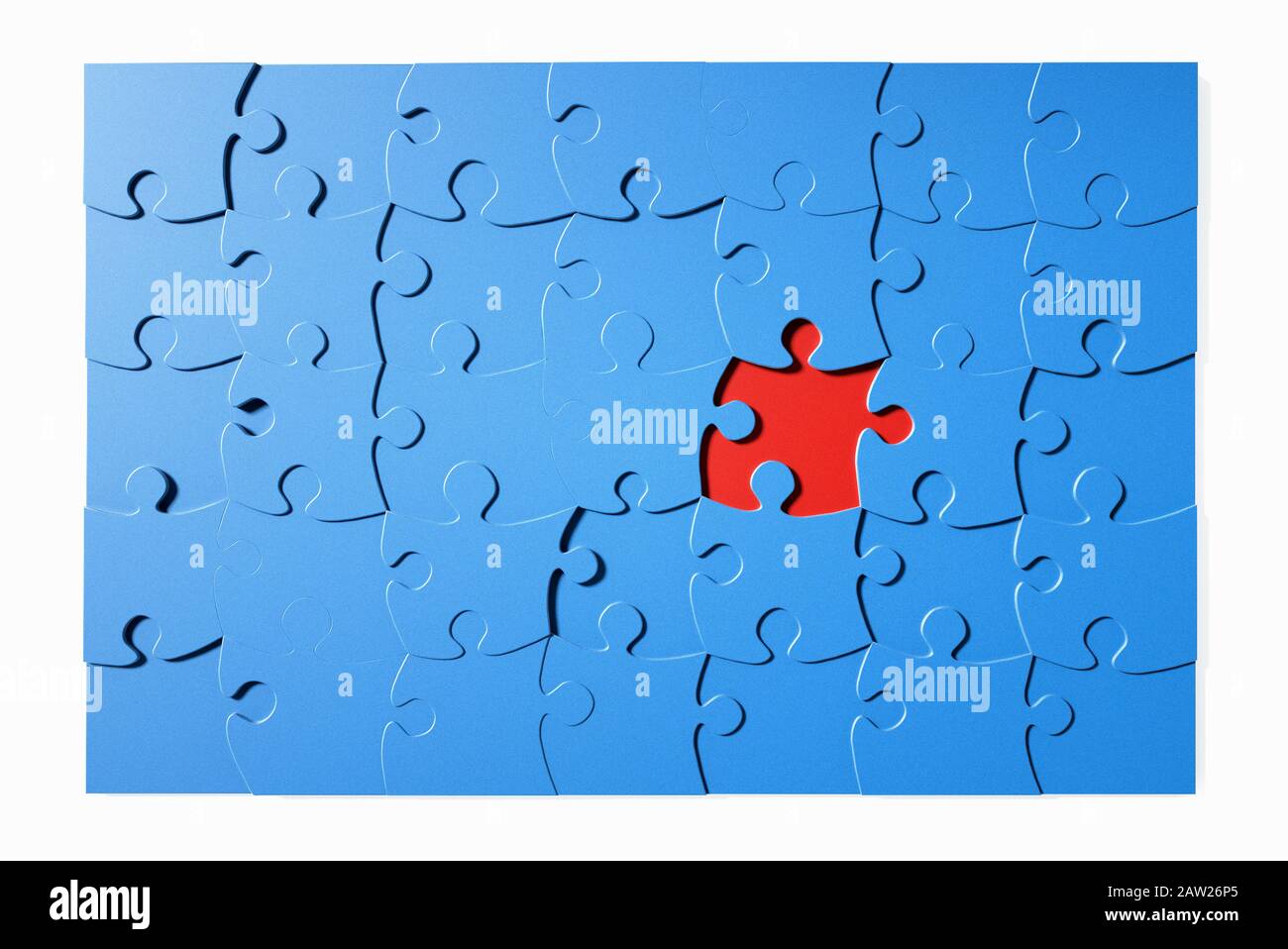 Blue jigsaw puzzle with one piece missing Stock Photo