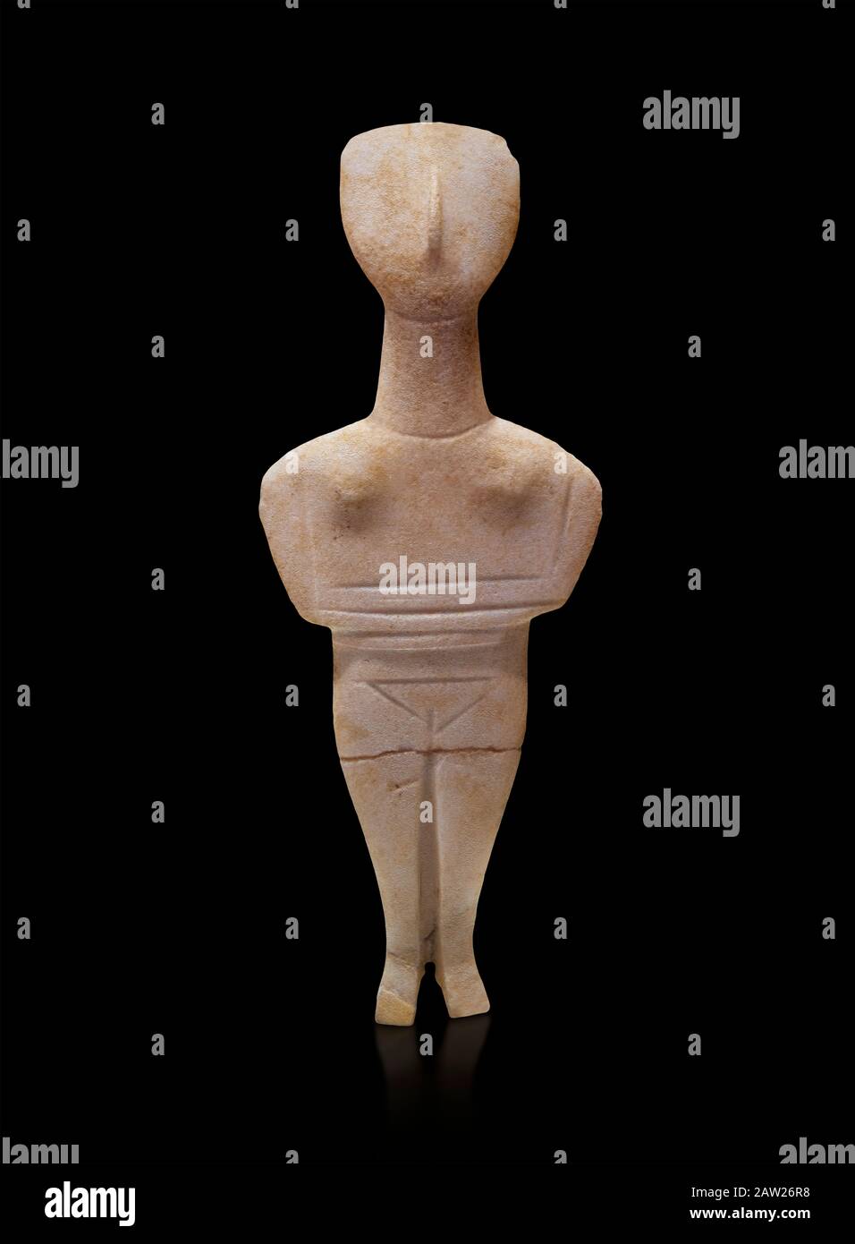 Cyclades spedos type stone statue figurine with folded arms, Archanes Phourni, 2300-1700 BC. Heraklion Archaeological Museum, black background.  These Stock Photo