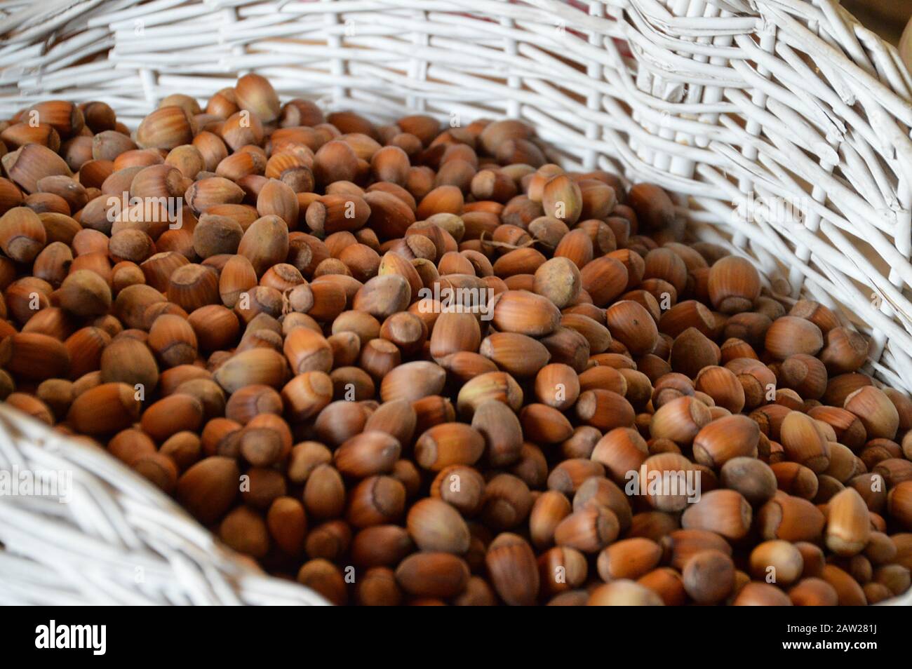 a great lot of nuts in a white basket Stock Photo