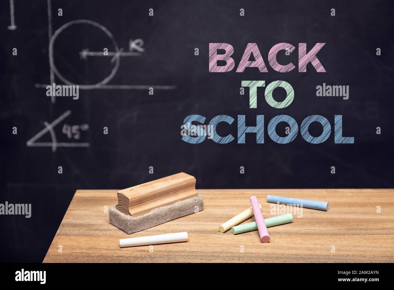 Colored chalk and eraser on wooden desk and chalkboard background Stock  Photo by formatoriginal