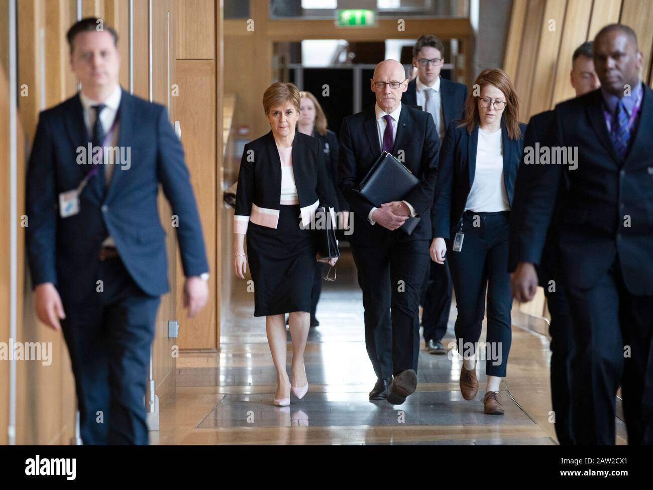 First Minister Nicola Sturgeon (left) and Deputy First Minister John Swinney arrive at the debating chamber ahead of FMQs at the Scottish Parliament in Edinburgh. Stock Photo