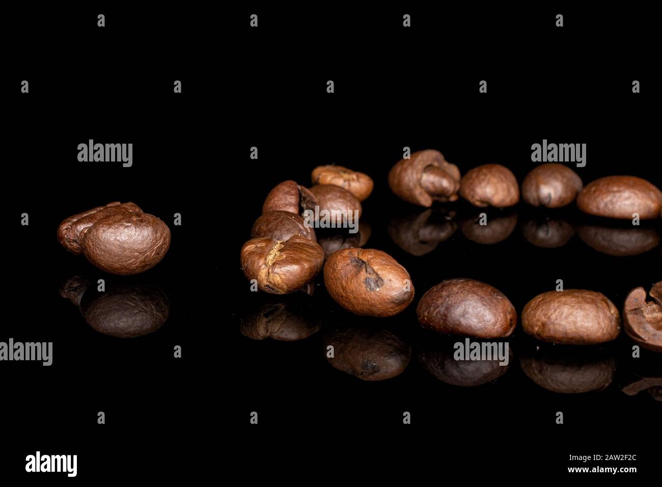 Lot Of Whole Fresh Coffee Bean Ring Isolated On Black Glass Stock Photo Alamy