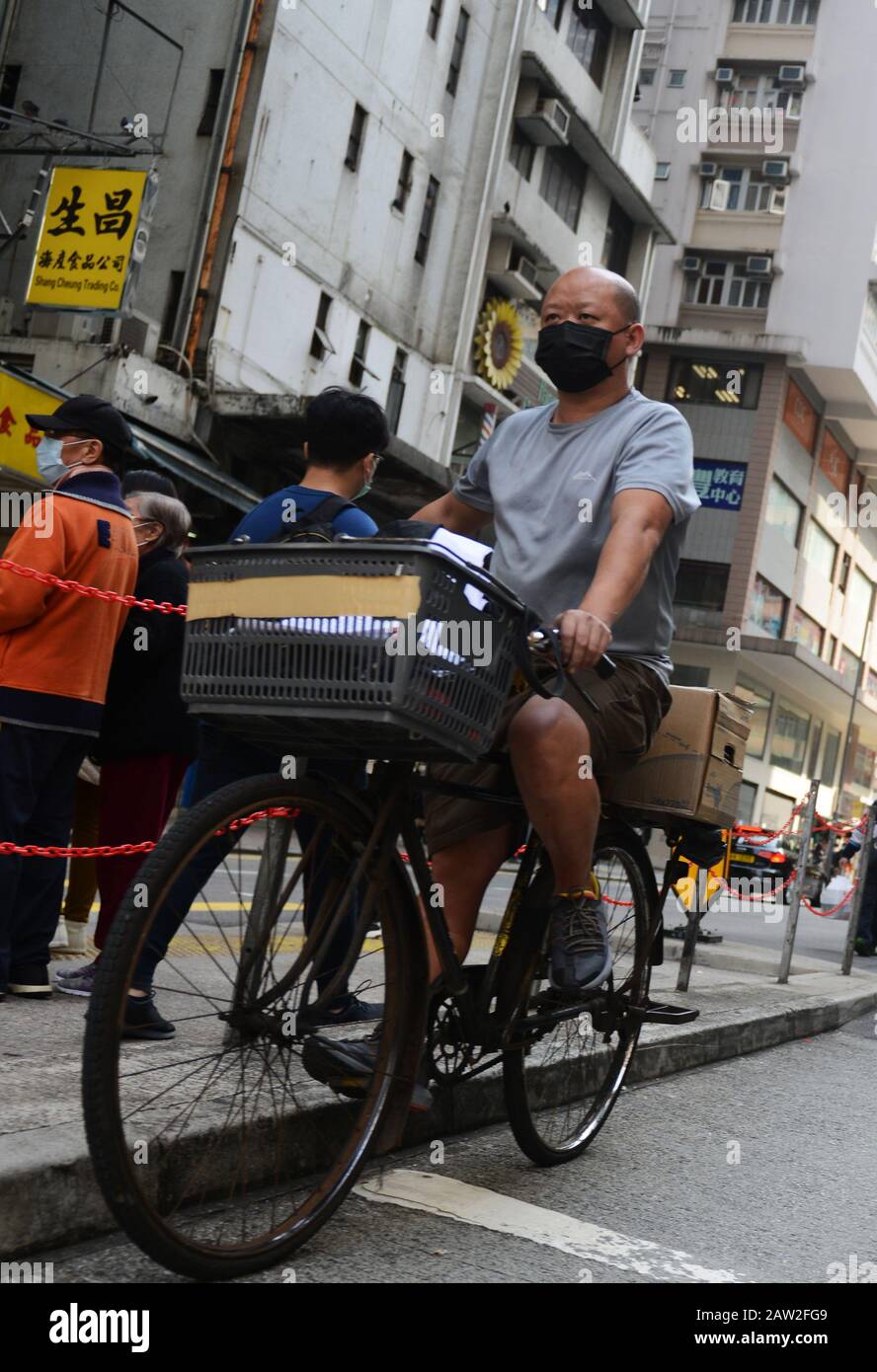 Hong Kongers wearing surgical masks during t he Wuhan Corona Virus epidemic. Stock Photo