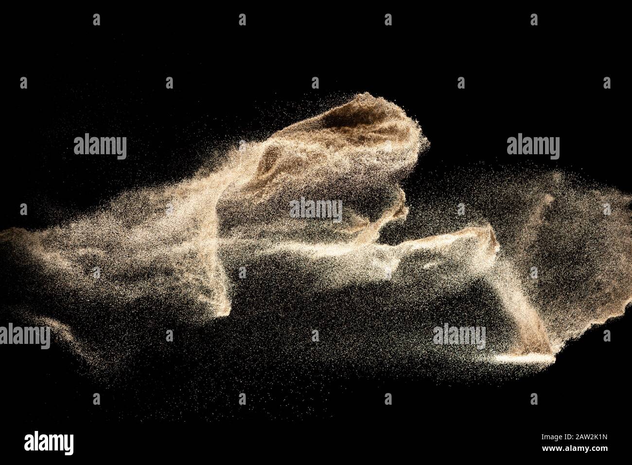 Dry river sand explosion isolated on black background. Abstract sand cloud.Brown colored sand splash. Stock Photo