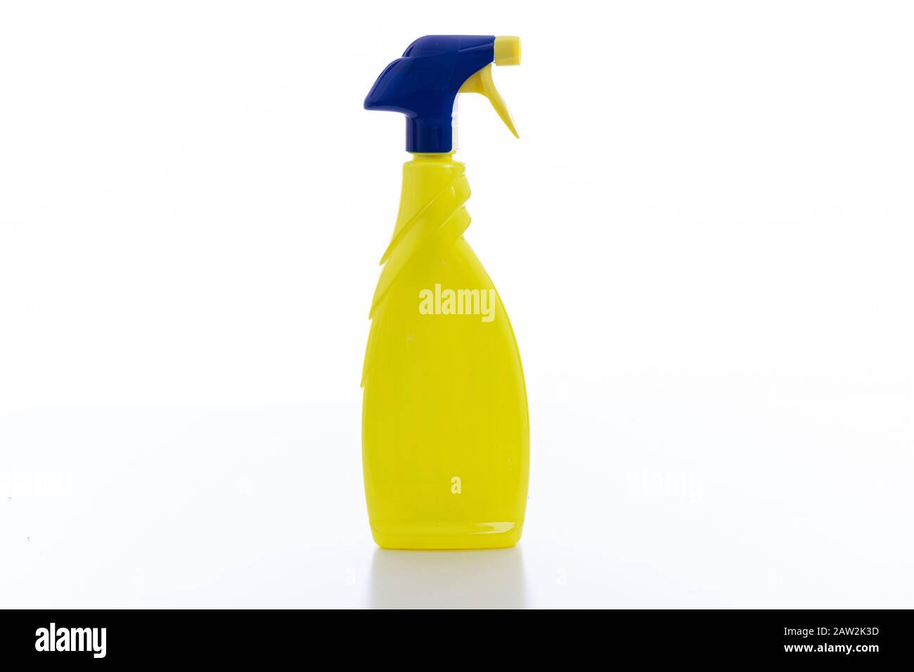 Cleaning spray bottle yellow color with blue trigger isolated against white background. Chemical detergent product no name template, blank empty, copy Stock Photo