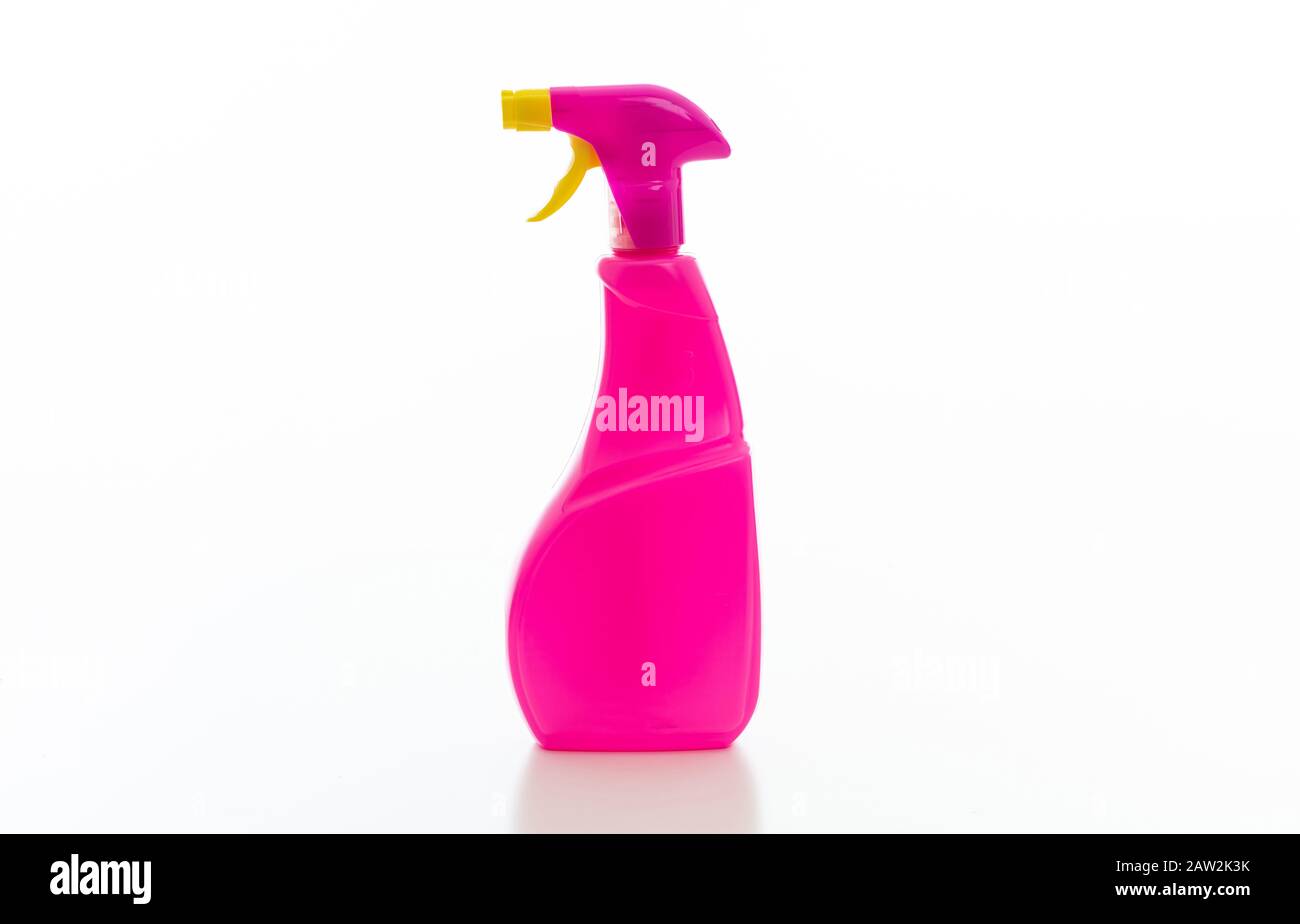 Cleaning spray bottle with pink and yellow trigger isolated against white background. Chemical detergent product no name template, blank empty label, Stock Photo
