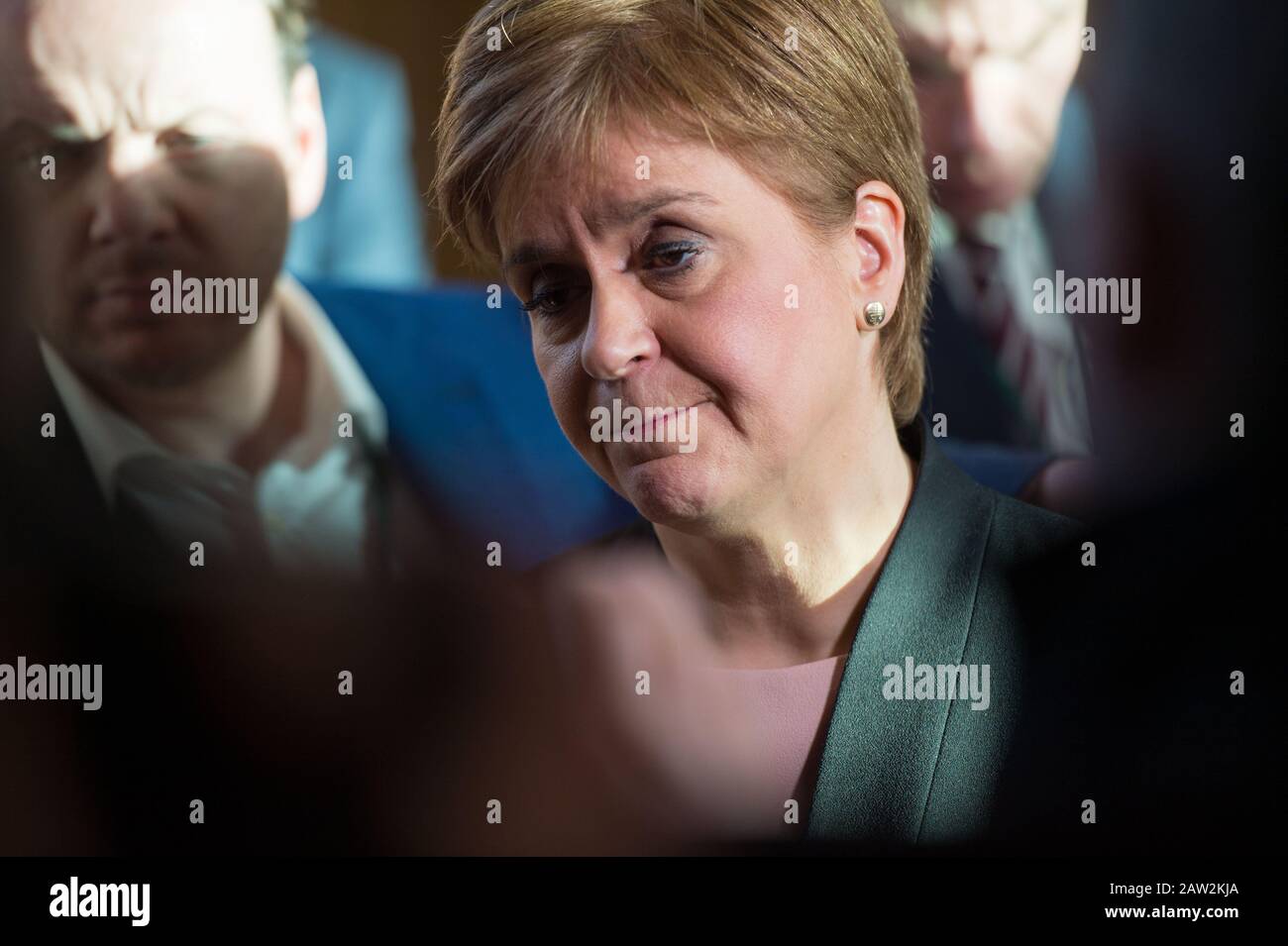 Edinburgh, UK. 6th Feb, 2020. Pictured: Nicola Sturgeon MSP - First Minister of Scotland and Leader of the Scottish National Party (SNP). The First Minister, Nicola Sturgeon answers questions to an awaiting media pack after she emerges from the chamber from First Ministers Questions. Finance Minister Derek Mackay was due to unveil his budget, First Ministers Questions was marred by last nights resignation of Finance Minister. Kate Forbes will now be delivering the budget later on this afternoon. Credit: Colin Fisher/Alamy Live News Stock Photo