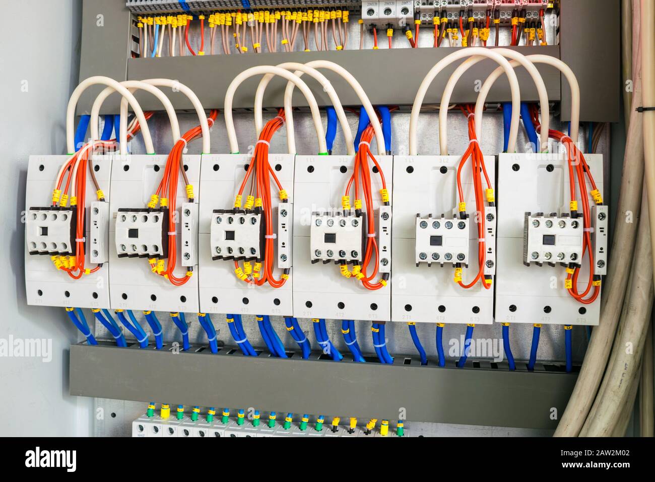 The mains electrical equipment is installed in an electrical box. Multicolored wires are