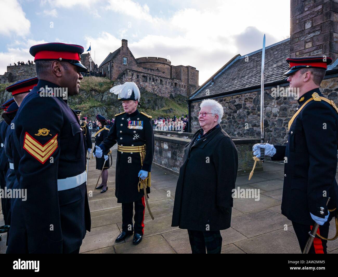 Edinburgh Castle, Edinburgh, Scotland, United Kingdom, 06 February 2020. 21 Gun Salute: The salute by the 26 Regiment Royal Artillery marks the occasion of the Queen’s accession to the throne on 6th February 1952. Val McDermid, Scottish crime writer inspects the regiment marking 20 years since the LGBT ban in the British Army was lifted with General Alastair Bruce Stock Photo