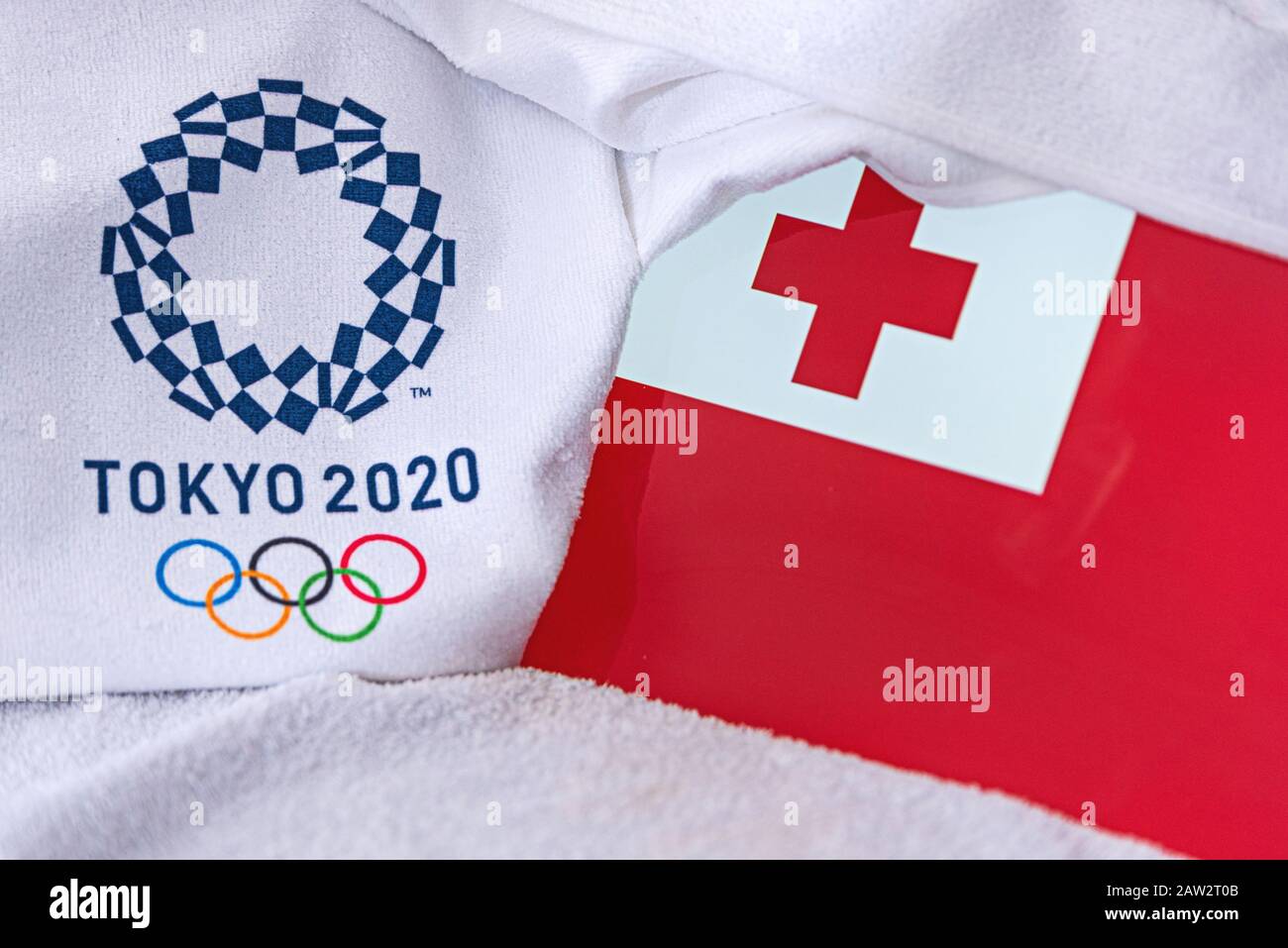 TOKYO, JAPAN, FEBRUARY. 4, 2020: Tonga National flag, official logo of summer olympic games in Tokyo 2020. White background Stock Photo