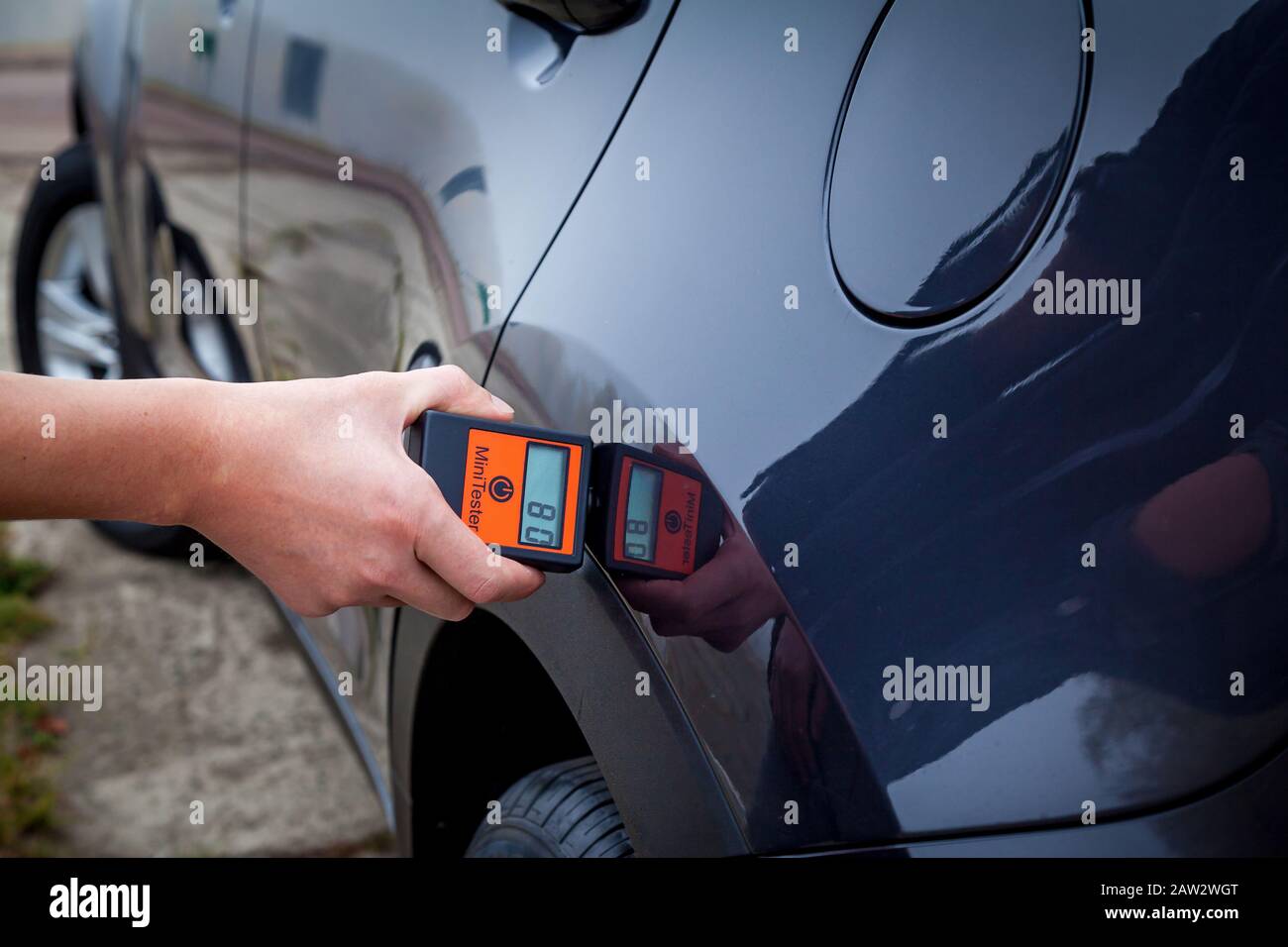 Measuring the thickness of the car paint coating in black color using a