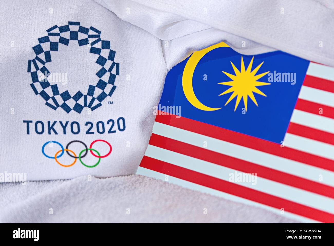 TOKYO, JAPAN, FEBRUARY. 4, 2020: Malaysia National flag, official logo of summer olympic games in Tokyo 2020. White background Stock Photo