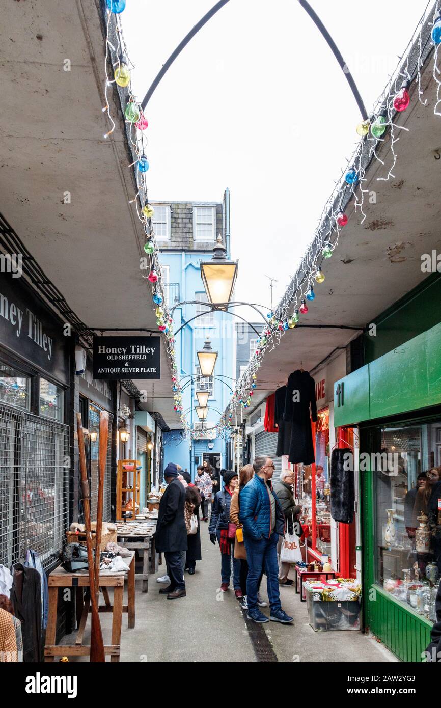 Shoppers browsing the antique shops and stalls in Pierrepont Row, off